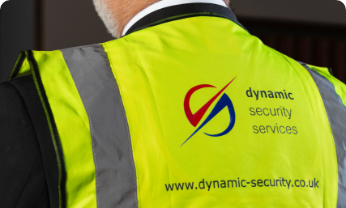 Security guard wearing a Dynamic Security Services hi vis vest