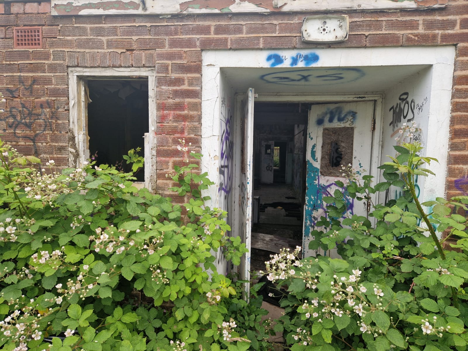 Outside the fire-damaged and vandalised vacant property in Birmingham.